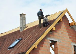 Roofing experts on roof