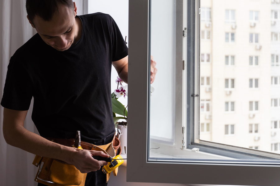 expert working on impact window installation